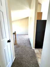 Hall with light carpet and baseboards