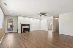 Looking back at the entrance. Note the fireplace, the laundry and half bath to the right, and the stairs to the far right.