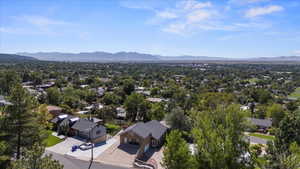 Aerial perspective of suburban area with a mountainous background