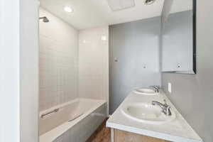 Primary ensuite with double sink and full size shower/bath. Separate WC
