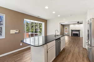 Big window with a bench seat lets light pour into the kitchen