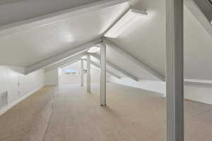 Finished attic with venting and carpet. Great for a play room or hangout space
