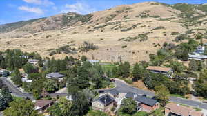 Aerial view of property's location with mountains - that green field is part of 'cheese park' - officially known as Twin Hollow Park - with fields, playgrounds, and pickleball courts!