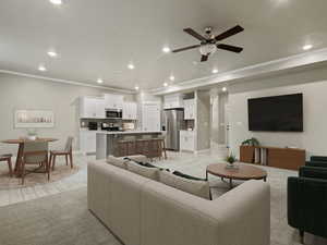 Living room with recessed lighting, crown molding, ceiling fan, and light wood-type flooring