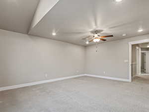 Empty room with light carpet, recessed lighting, a ceiling fan, and a textured ceiling
