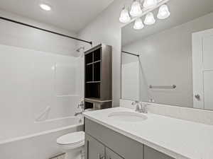 Full bathroom featuring bathing tub / shower combination, vanity, and light tile patterned flooring