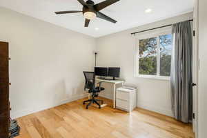 Home office with light wood finished floors, recessed lighting, and a ceiling fan