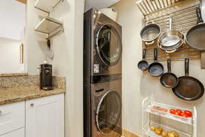 Laundry area featuring stacked washer / dryer