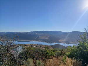 View of mountain backdrop with a nearby body of water