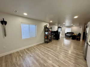 Dining space featuring light wood finished floors, recessed lighting, and a desk