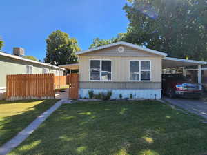 Manufactured / mobile home with an attached carport