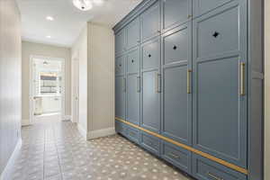 Mudroom with baseboards and recessed lighting