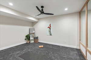 Workout room with recessed lighting and ceiling fan