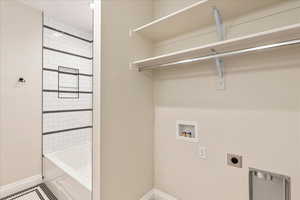 Laundry room featuring washer hookup, electric dryer hookup, and tile patterned flooring