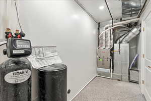 Utility room featuring heating unit