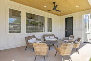 View of patio with an outdoor hangout area and a ceiling fan, accessible from the primary bedroom.