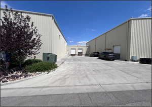 View of parking featuring a detached garage