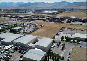 Drone / aerial view of an industrial area and a mountainous background
