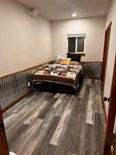 Bedroom featuring wood finished floors and recessed lighting