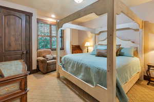 Bedroom featuring light colored carpet and Jack n Jill bathroom