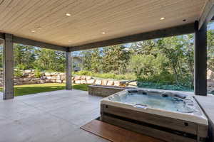 View of patio / terrace with an outdoor hot tub