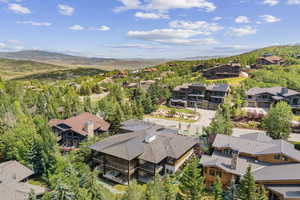 Aerial perspective of suburban area with a mountain backdrop