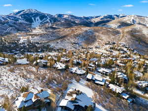 Snowy aerial view with a mountain view