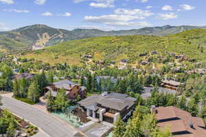 View of property location with mountains and nearby suburban area