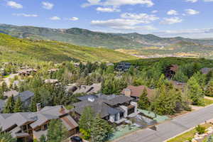 Aerial view of residential area featuring a mountain backdrop
