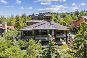 Back of property featuring a standing seam roof, a metal roof, and a patio area