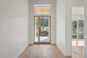 Entrance foyer featuring light wood-type flooring and baseboards