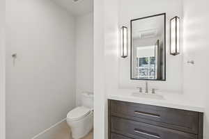 Bathroom with vanity and light tile patterned floors