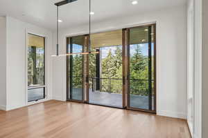 Doorway to outside featuring wood finished floors and recessed lighting