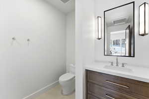 Bathroom with vanity and toilet