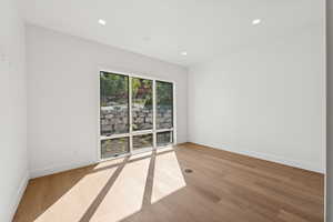 Unfurnished room with recessed lighting and light wood-style floors