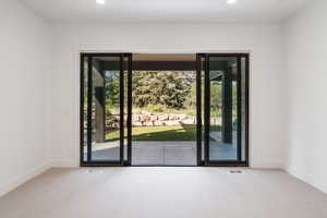 Doorway featuring carpet and recessed lighting