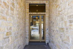 View of exterior entry with stone siding