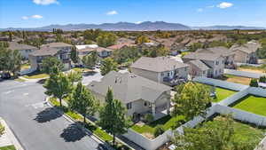 Aerial perspective of suburban area with a mountainous background