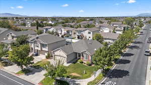 Aerial perspective of suburban area featuring a mountain backdrop
