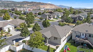 Aerial perspective of suburban area featuring a mountain backdrop