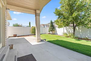 Fenced backyard featuring a patio