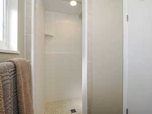 Full bathroom with a shower stall