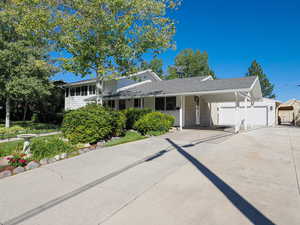 Side view of home with carport and a 2 car garage