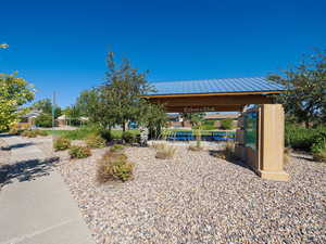Adjacent park featuring a covered patio/picnic area
