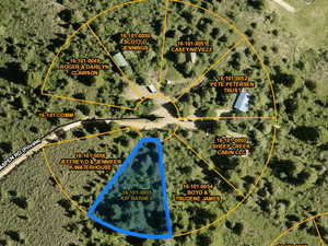 Aerial map of property and surrounding area featuring property boundaries highlighted