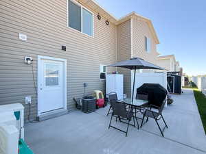 View of patio / terrace with outdoor dining space, a grill, and a gazebo