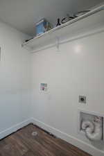Laundry area featuring dark wood finished floors, hookup for a washing machine, and electric dryer hookup