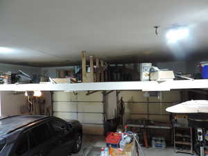 View of garage and extra storage loft