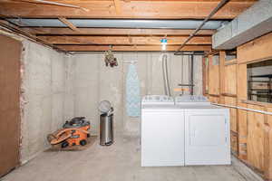 Laundry area featuring independent washer and dryer