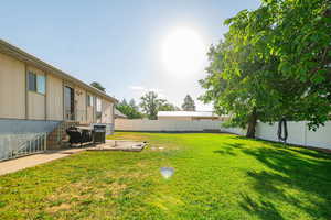 Fenced backyard with a patio area